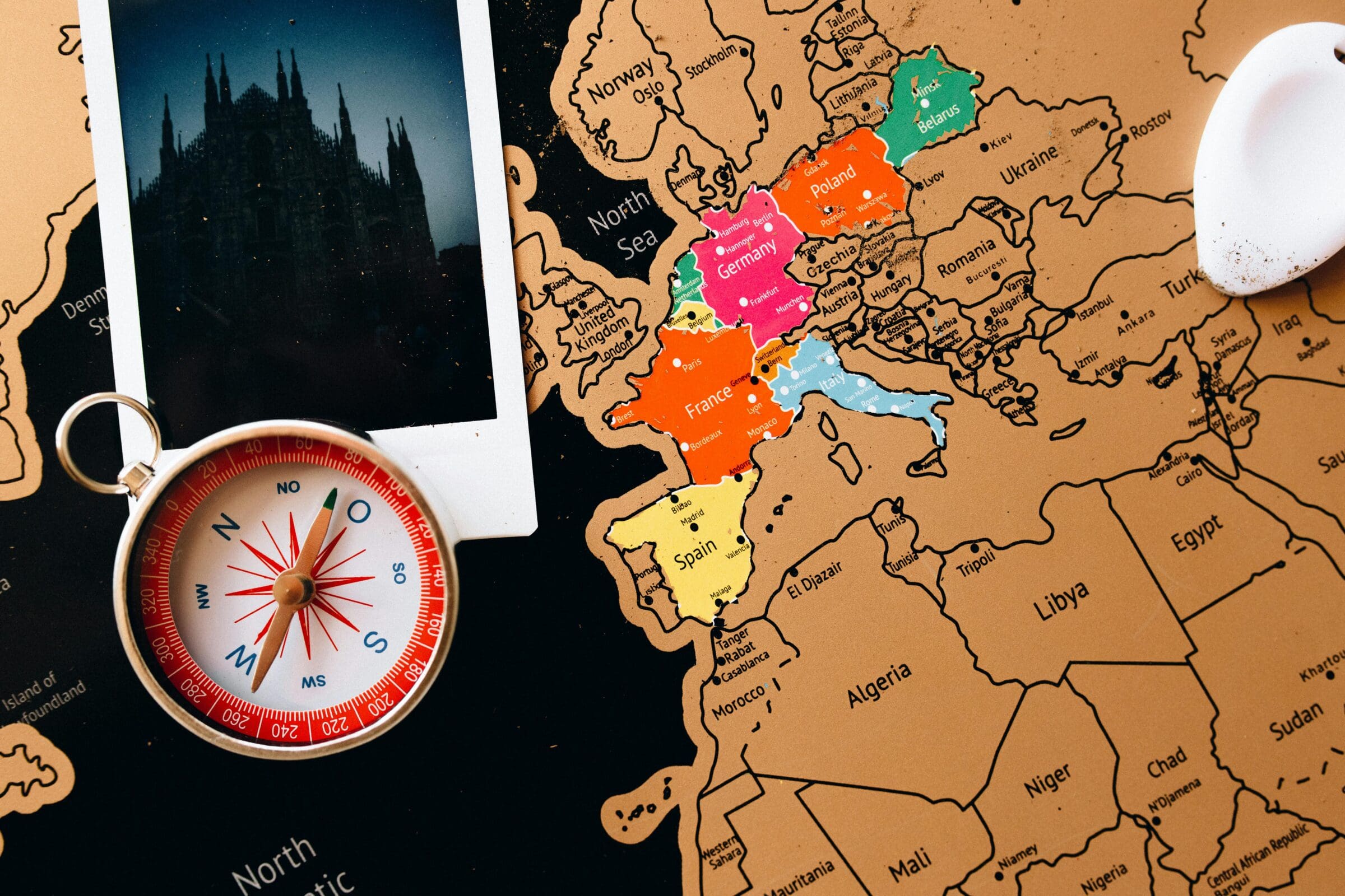 Black and gold map background with compass and phone