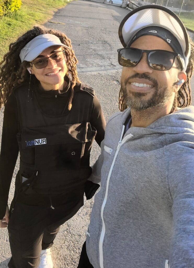 a cute couple exercises outside