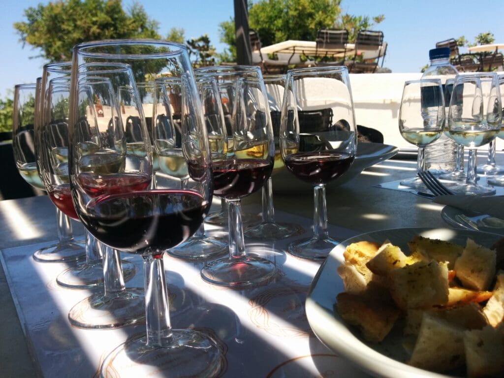 many rows of wine glasses for tasting at Domaine Sigalas in Santorini 