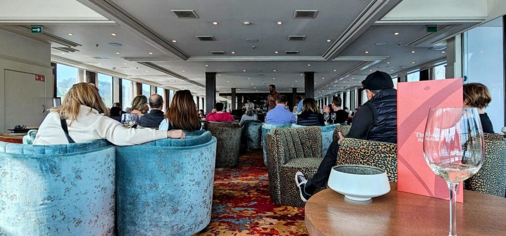 People in a lounge litening to a speaker