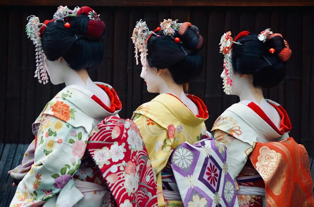 Back View of Japanese Women Wearing Patterned Kimonos