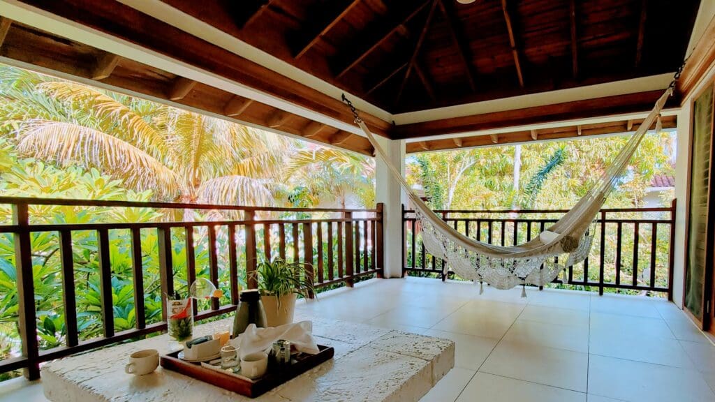 Large balcony with hammock and breakfast tray. 