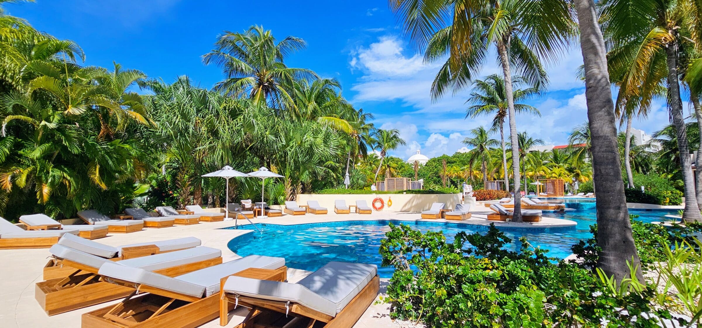 Pool surrounded by lounge chairs