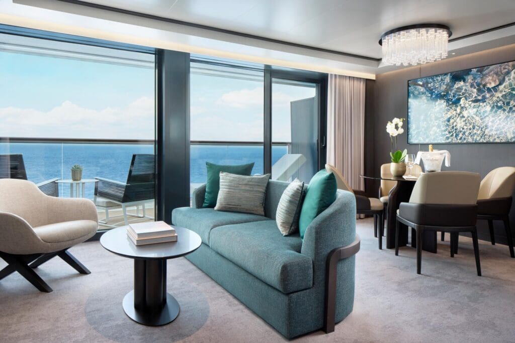 Spacious yacht cabin living room with ocean view balcony